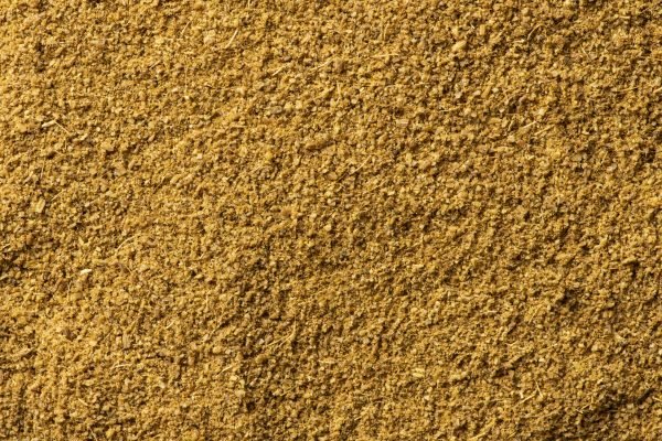 Texture of Cumin powder close-up, spice or seasoning as background