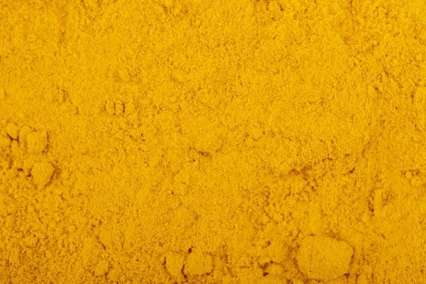 top view of turmeric powder background and texture